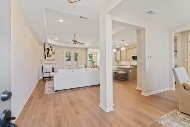 a view of a living room and a wooden floor
