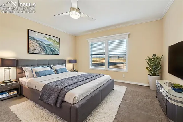 an empty room with windows and ceiling fan