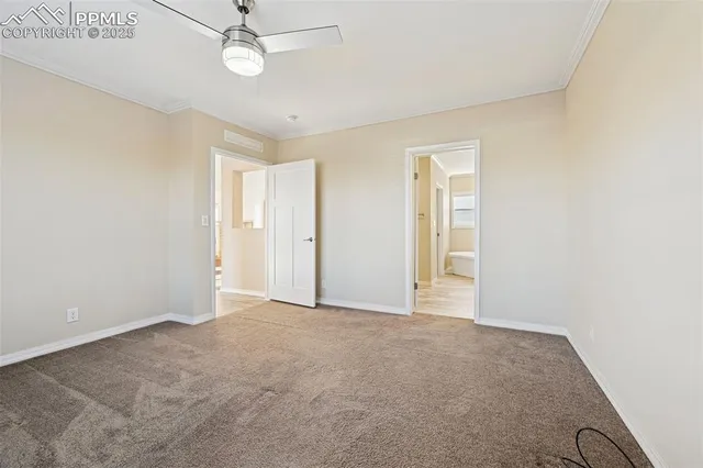 a spacious bathroom with a granite countertop sink a toilet and mirror