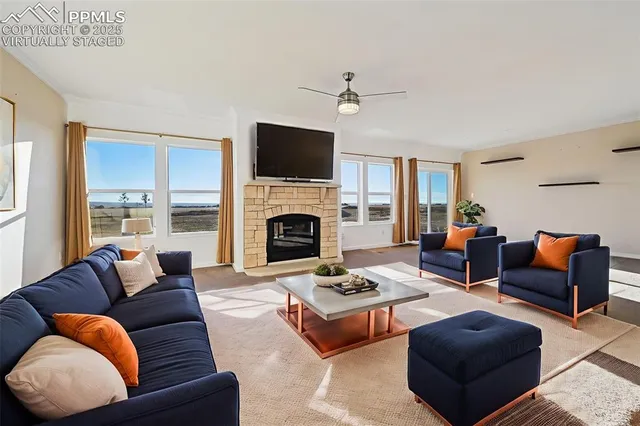 a view of an empty room with a fireplace and a window
