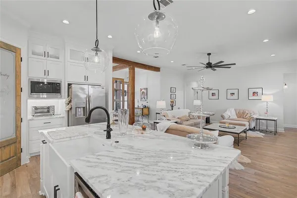 a kitchen with a refrigerator and cabinets