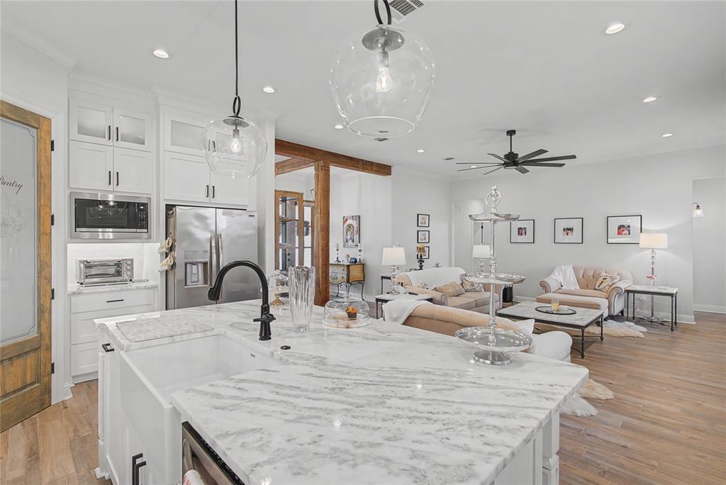 347 Ridge Drive Stonewall, LA 71078 - Photo 12 of 39 a large kitchen with stainless steel appliances kitchen island granite countertop a sink and cabinets