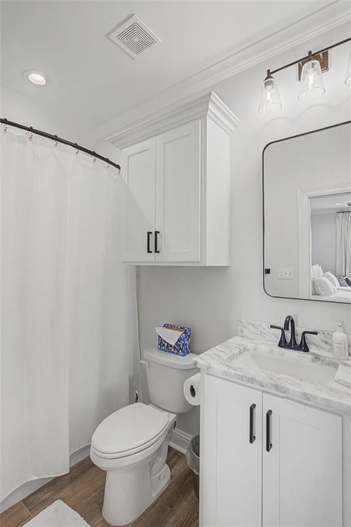 347 Ridge Drive Stonewall, LA 71078 - Photo 21 of 39 a bathroom with a granite countertop sink a toilet and a mirror