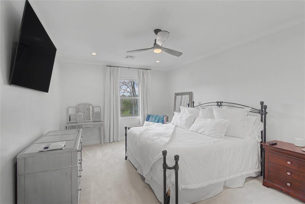 347 Ridge Drive Stonewall, LA 71078 - Photo 24 of 39 a bedroom with a bed and a flat tv screen on dresser