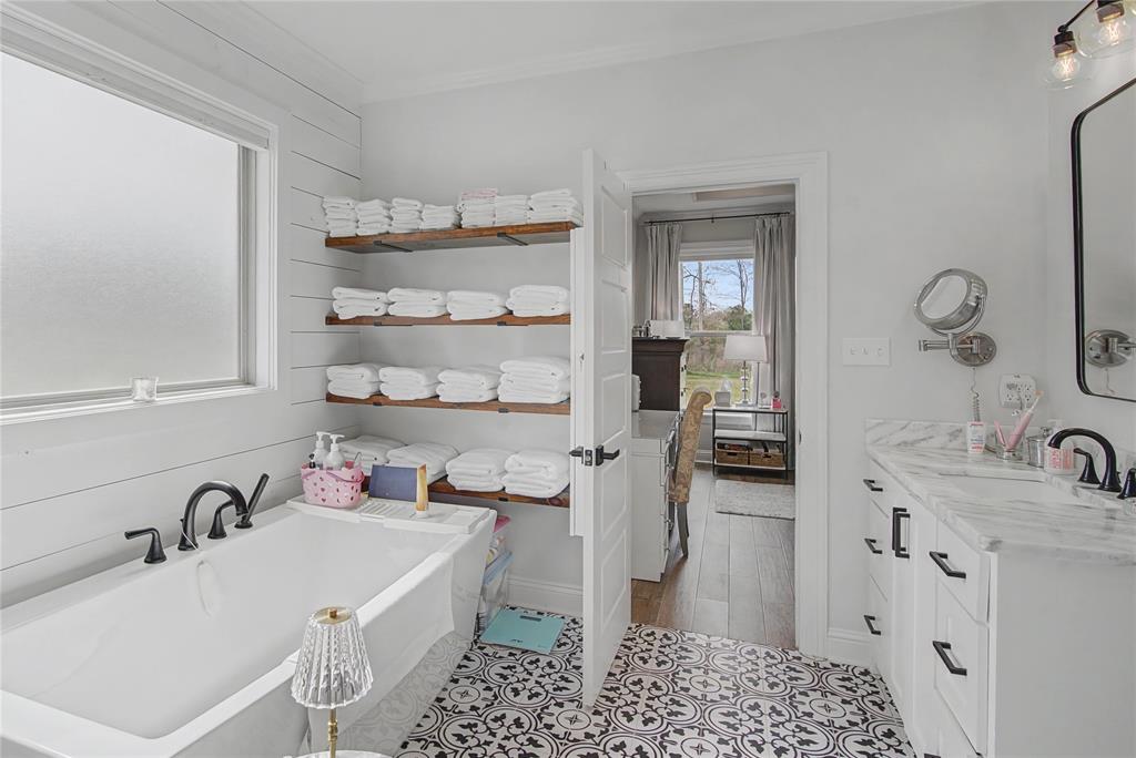 347 Ridge Drive Stonewall, LA 71078 - Photo 29 of 39 a bathroom with a sink a toilet and shower