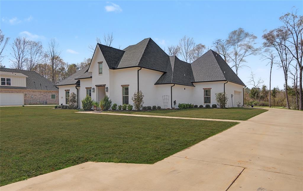 347 Ridge Drive Stonewall, LA 71078 - Photo 3 of 39 a front view of a house with garden