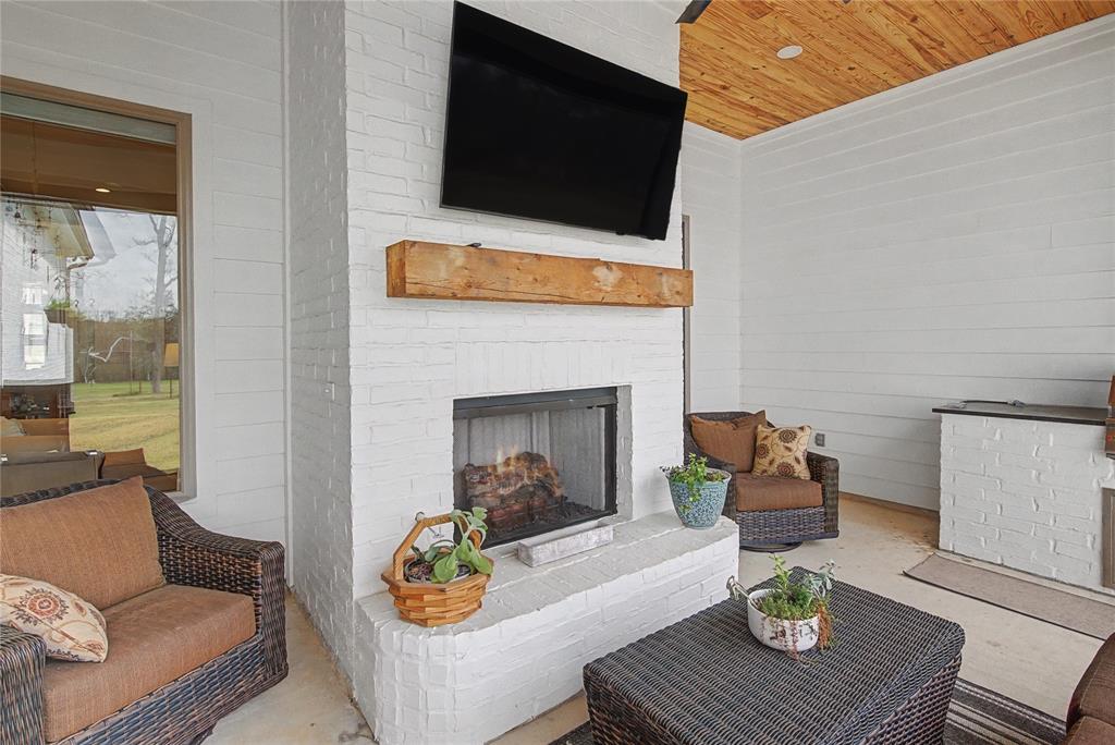 347 Ridge Drive Stonewall, LA 71078 - Photo 35 of 39 a living room with furniture and a flat screen tv