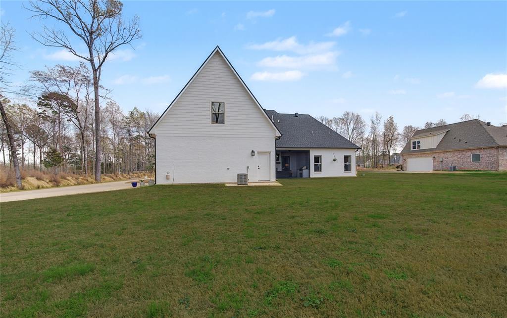 347 Ridge Drive Stonewall, LA 71078 - Photo 38 of 39 a view of a house with a big yard