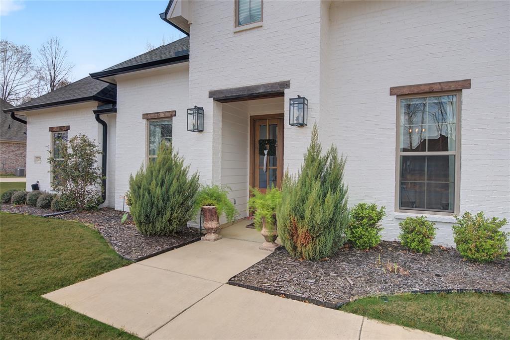 347 Ridge Drive Stonewall, LA 71078 - Photo 7 of 39 a front view of a house with garden