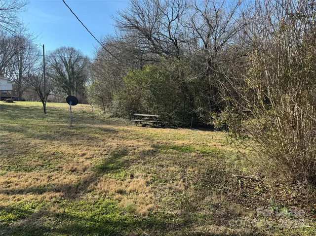 a view of outdoor space with trees all around