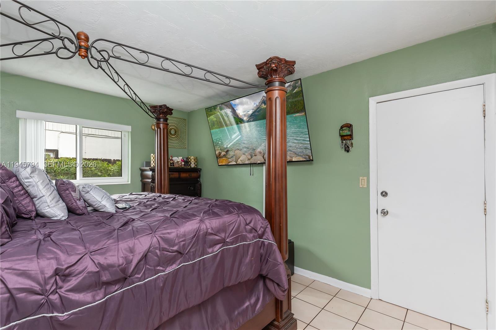 15244 Southwest 108th Court Miami, FL 33157 - Photo 22 of 47 a bedroom with a bed and a window