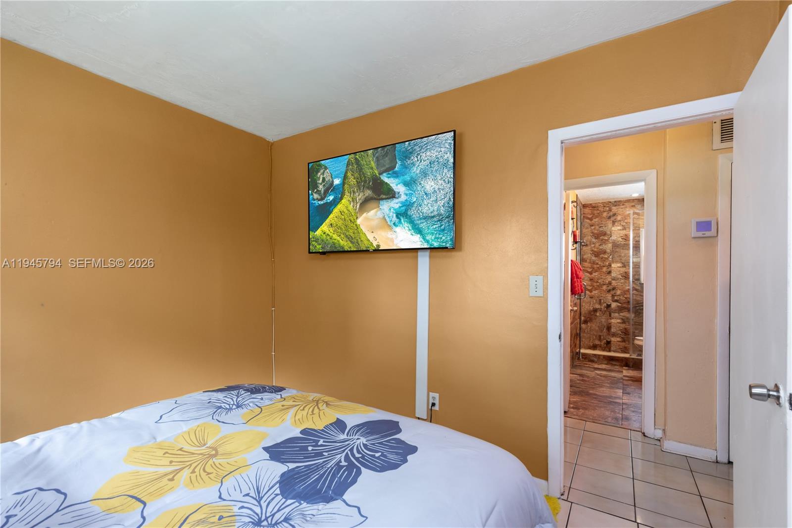 15244 Southwest 108th Court Miami, FL 33157 - Photo 24 of 47 a bedroom with a bed and a painting on the wall