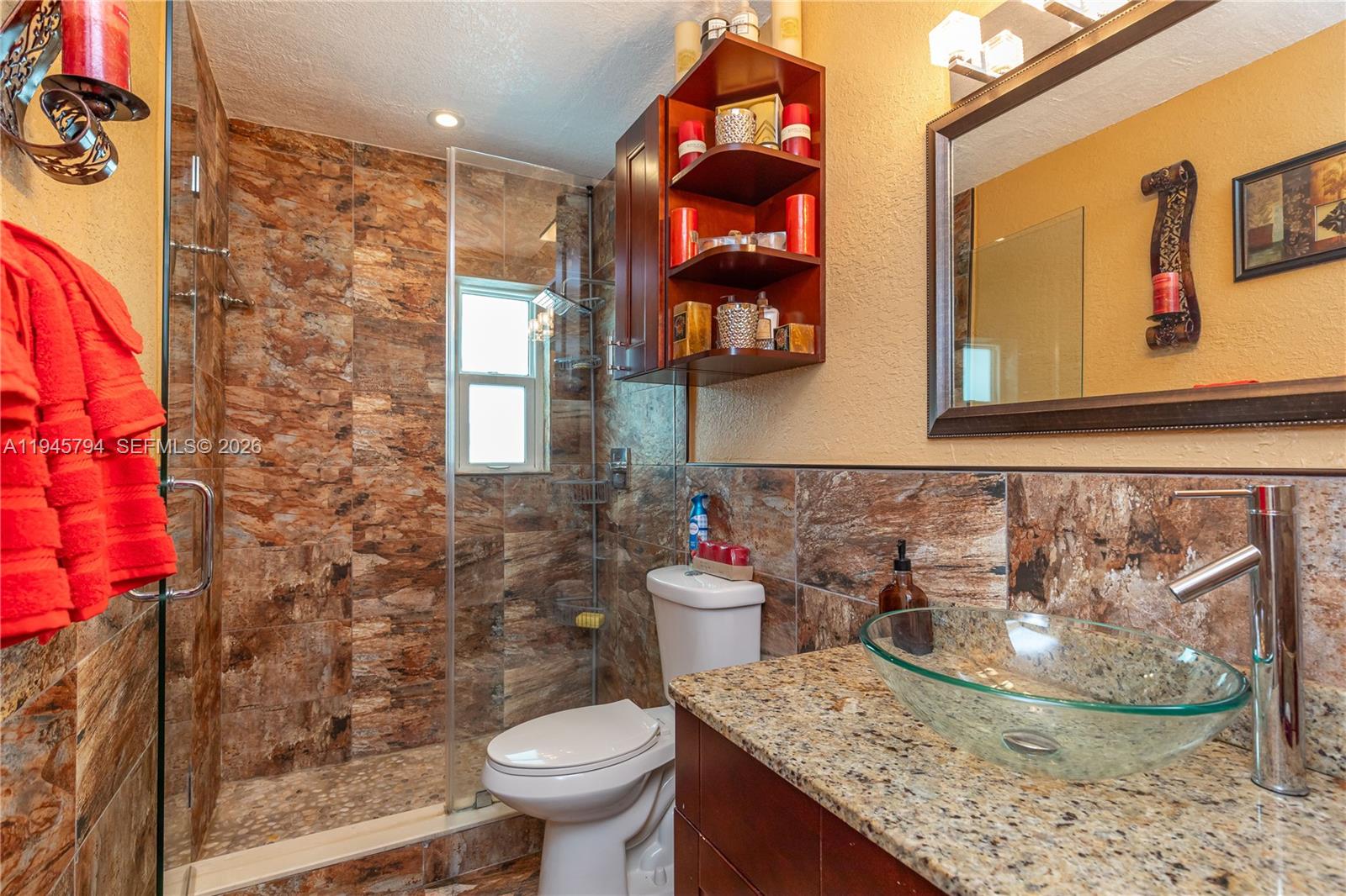 15244 Southwest 108th Court Miami, FL 33157 - Photo 28 of 47 a bathroom with a granite countertop toilet sink and mirror
