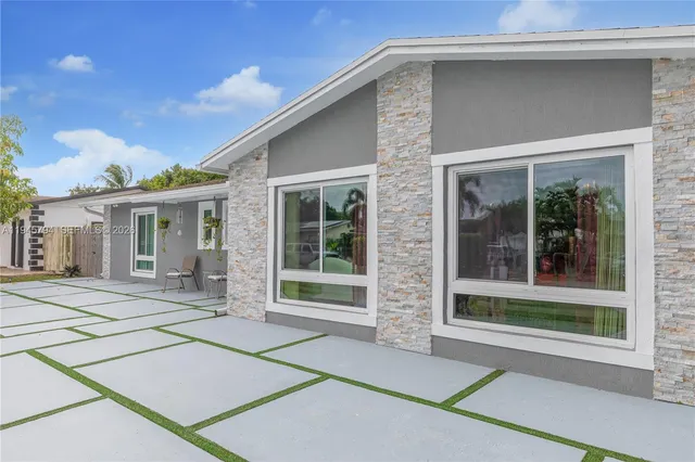 a living room with furniture fireplace and a chandelier