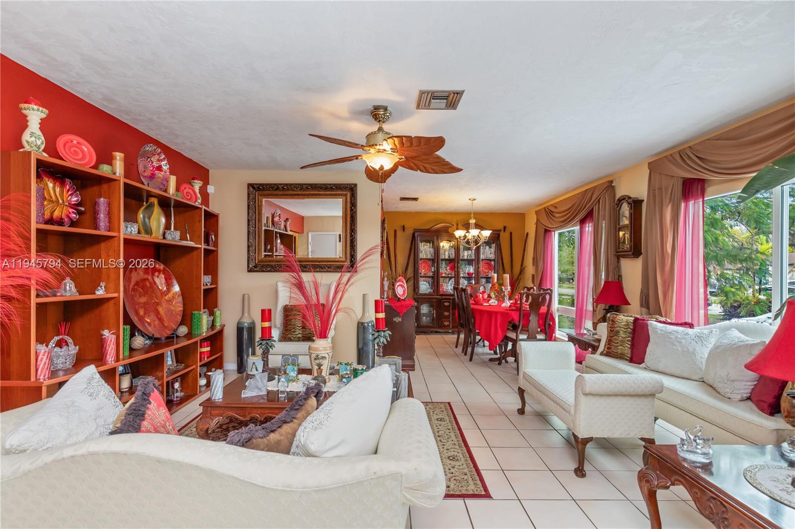 15244 Southwest 108th Court Miami, FL 33157 - Photo 31 of 47 a living room with lots of furniture and a chandelier