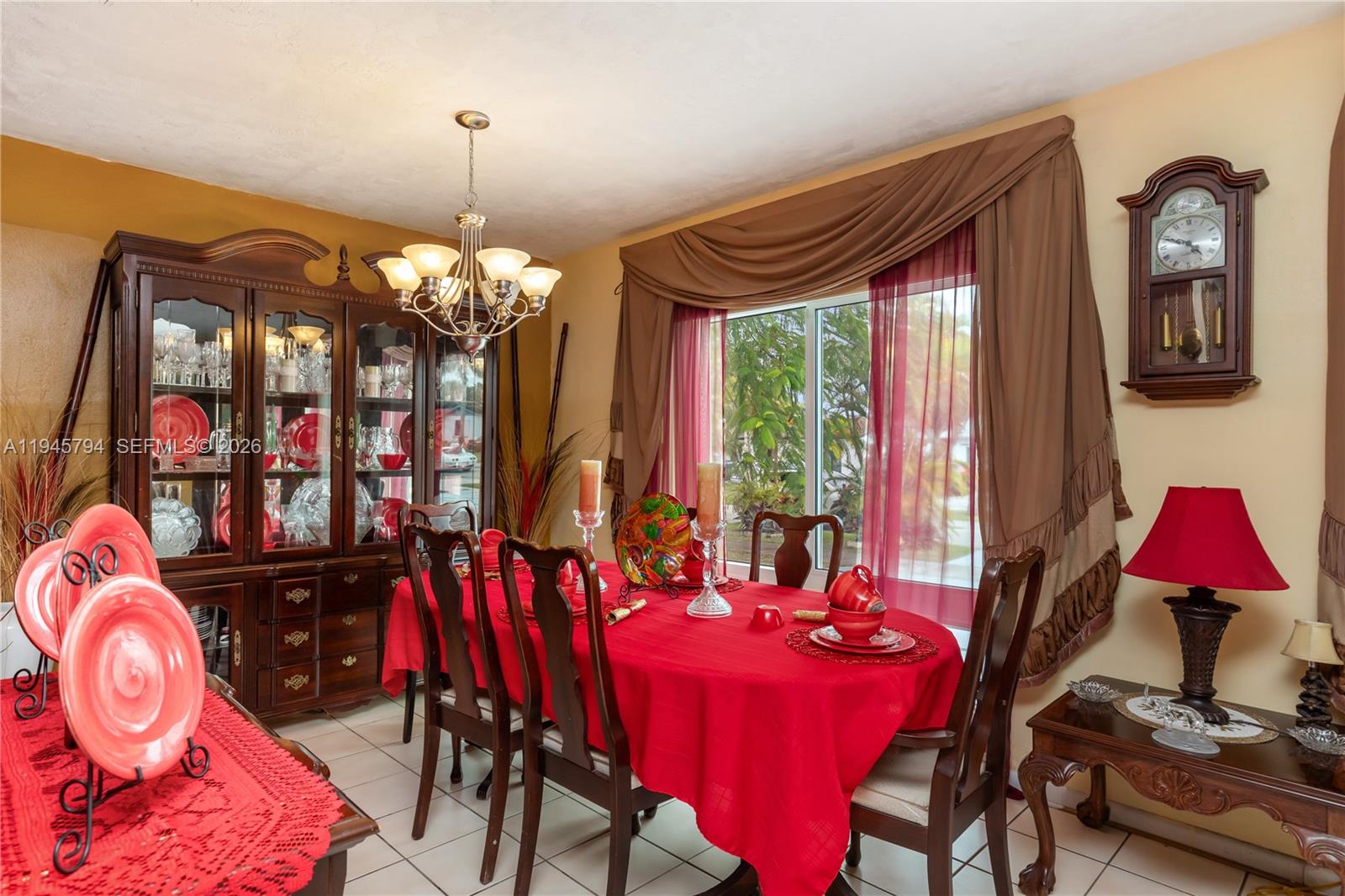 15244 Southwest 108th Court Miami, FL 33157 - Photo 32 of 47 a view of a dining room with furniture and chandelier