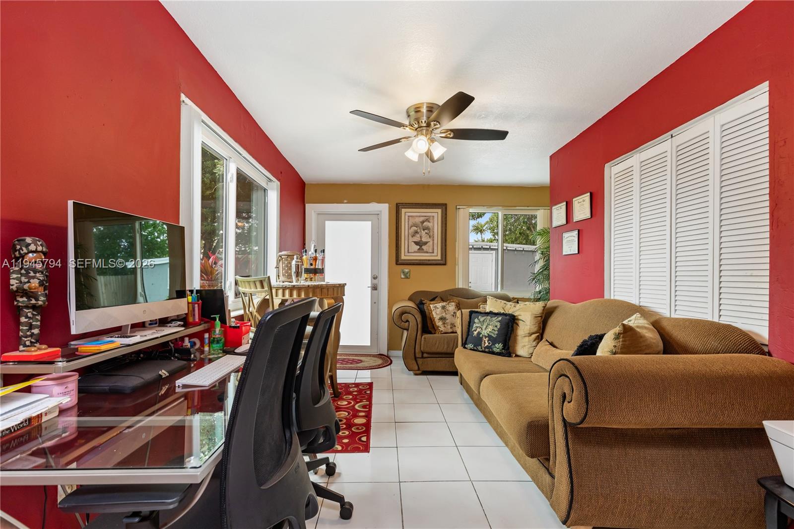 15244 Southwest 108th Court Miami, FL 33157 - Photo 35 of 47 a living room with furniture and a flat screen tv