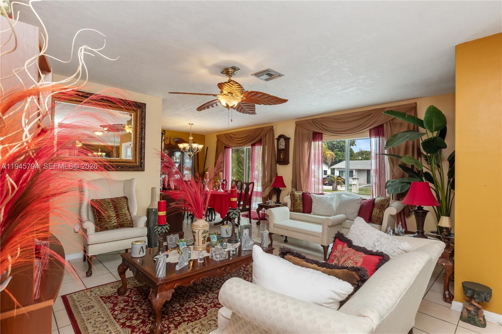 15244 Southwest 108th Court Miami, FL 33157 - Photo 4 of 47 a living room with furniture fireplace and a chandelier