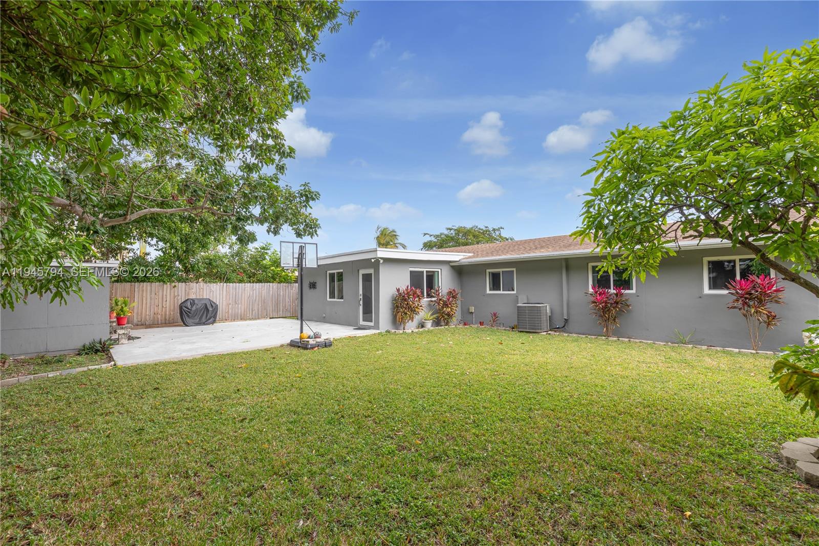 15244 Southwest 108th Court Miami, FL 33157 - Photo 41 of 47 a front view of a house with a garden