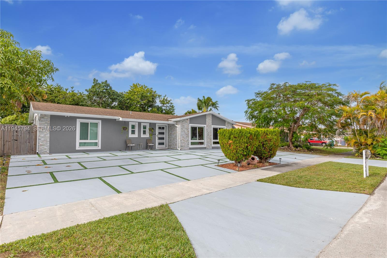 15244 Southwest 108th Court Miami, FL 33157 - Photo 46 of 47 a front view of a house with garden