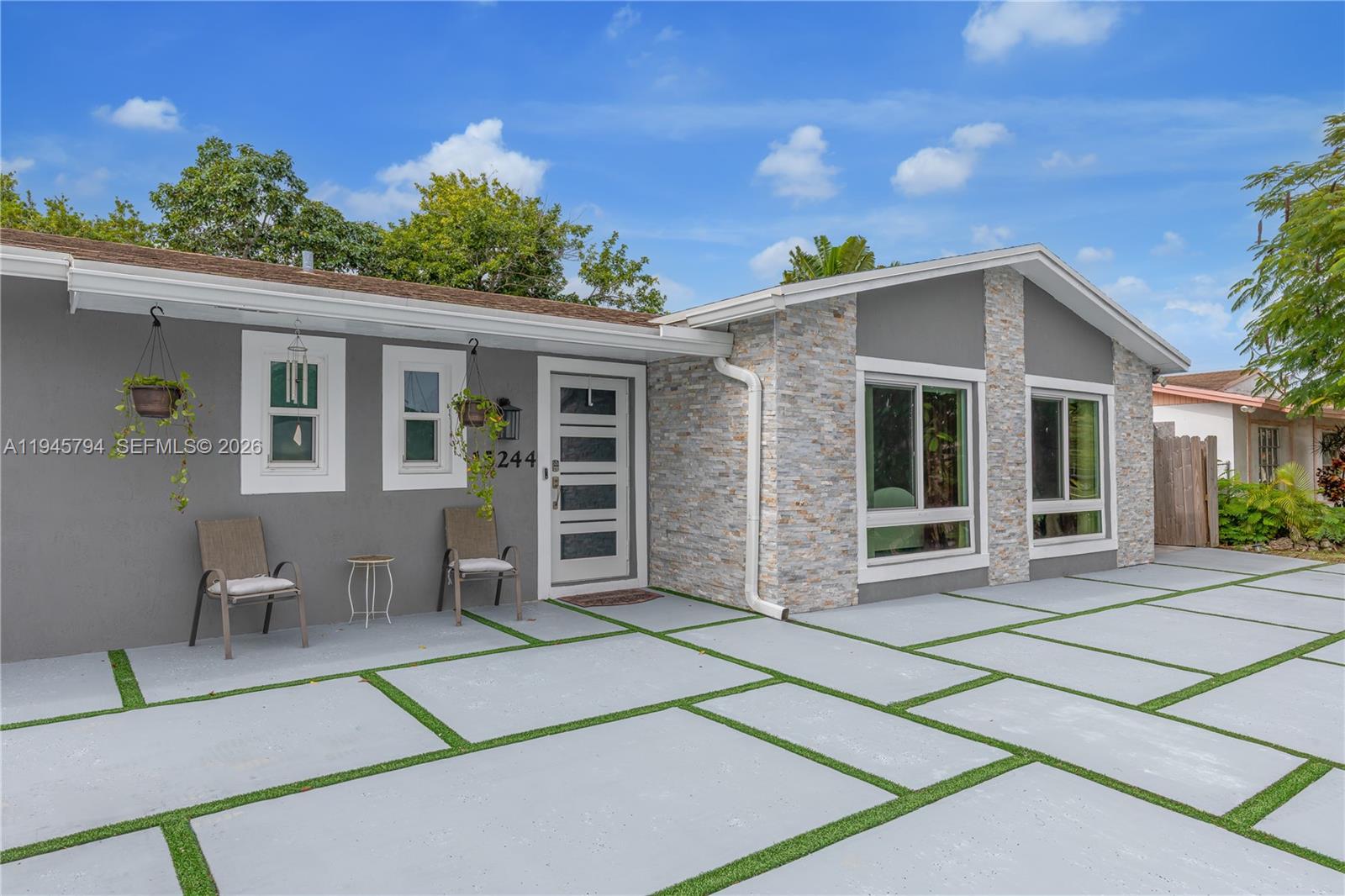 15244 Southwest 108th Court Miami, FL 33157 - Photo 47 of 47 a front view of a house with a garden