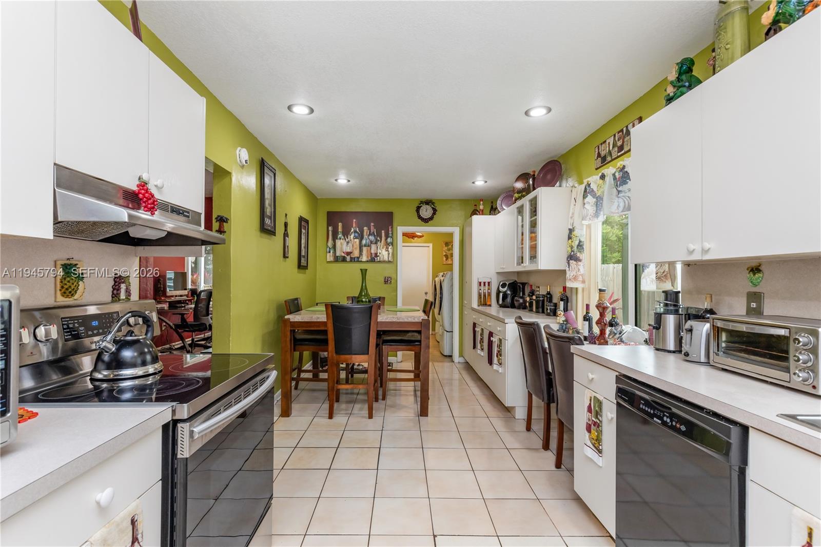 15244 Southwest 108th Court Miami, FL 33157 - Photo 8 of 47 a kitchen with stainless steel appliances granite countertop a sink a stove top oven a counter space and cabinets