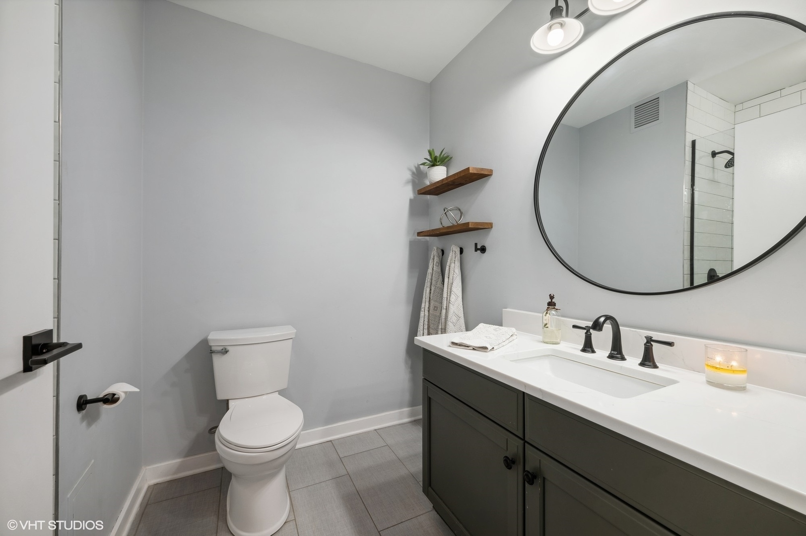 501 North Clinton Street, Unit 604 Chicago, IL 60654 - Photo 17 of 25 a bathroom with a toilet sink and mirror