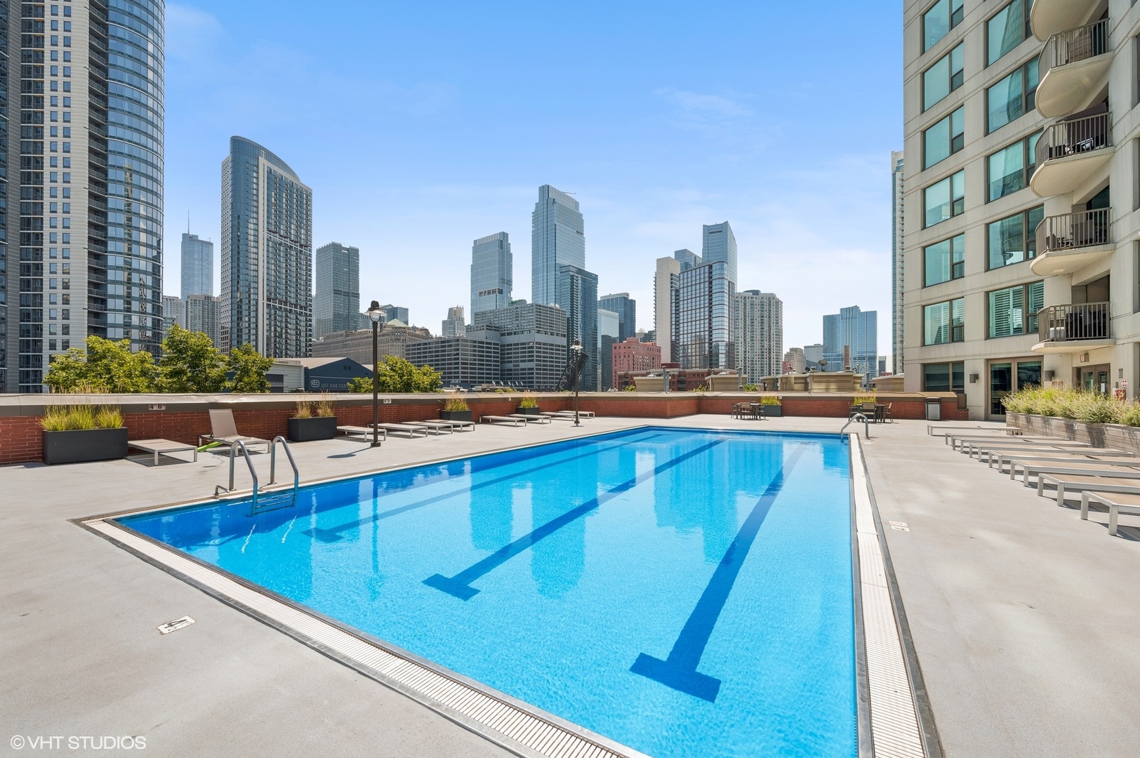 501 North Clinton Street, Unit 604 Chicago, IL 60654 - Photo 21 of 25 a view of a swimming pool with a lawn chairs