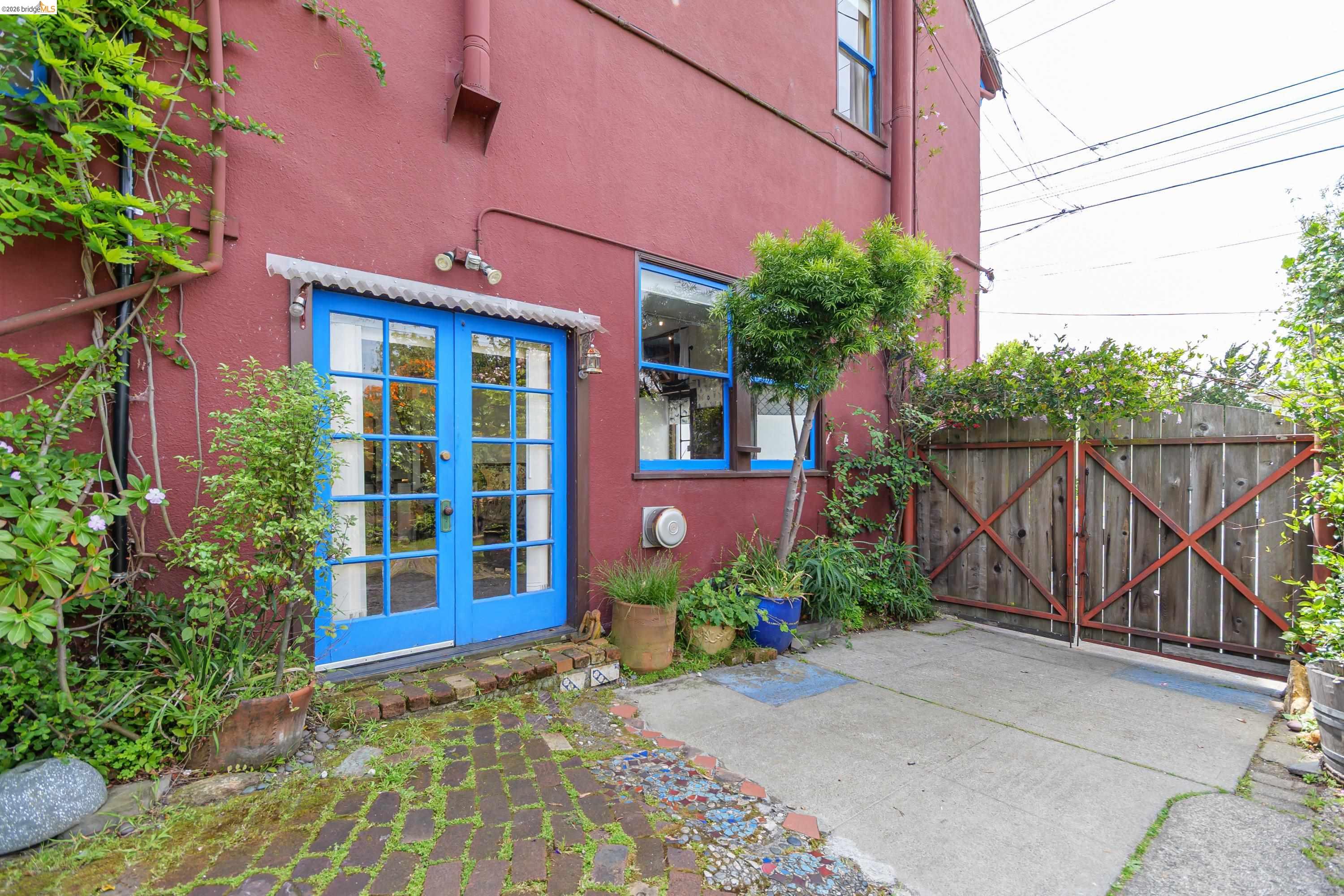 1735 Tenth Street Berkeley, CA 94710 - Photo 1 of 50 a front view of a house with glass windows and plants