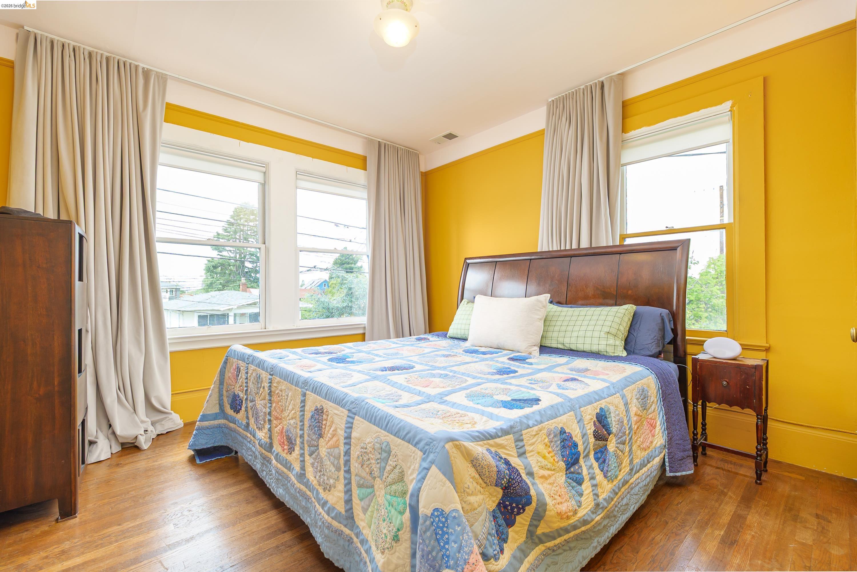 1735 Tenth Street Berkeley, CA 94710 - Photo 17 of 50 a bedroom with a bed and a window