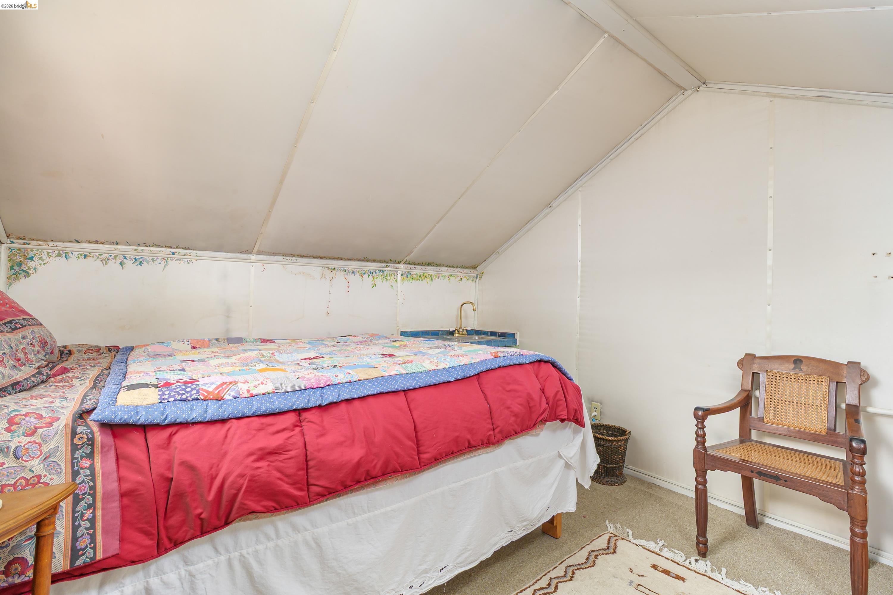 1735 Tenth Street Berkeley, CA 94710 - Photo 19 of 50 a bedroom with a bed and chair