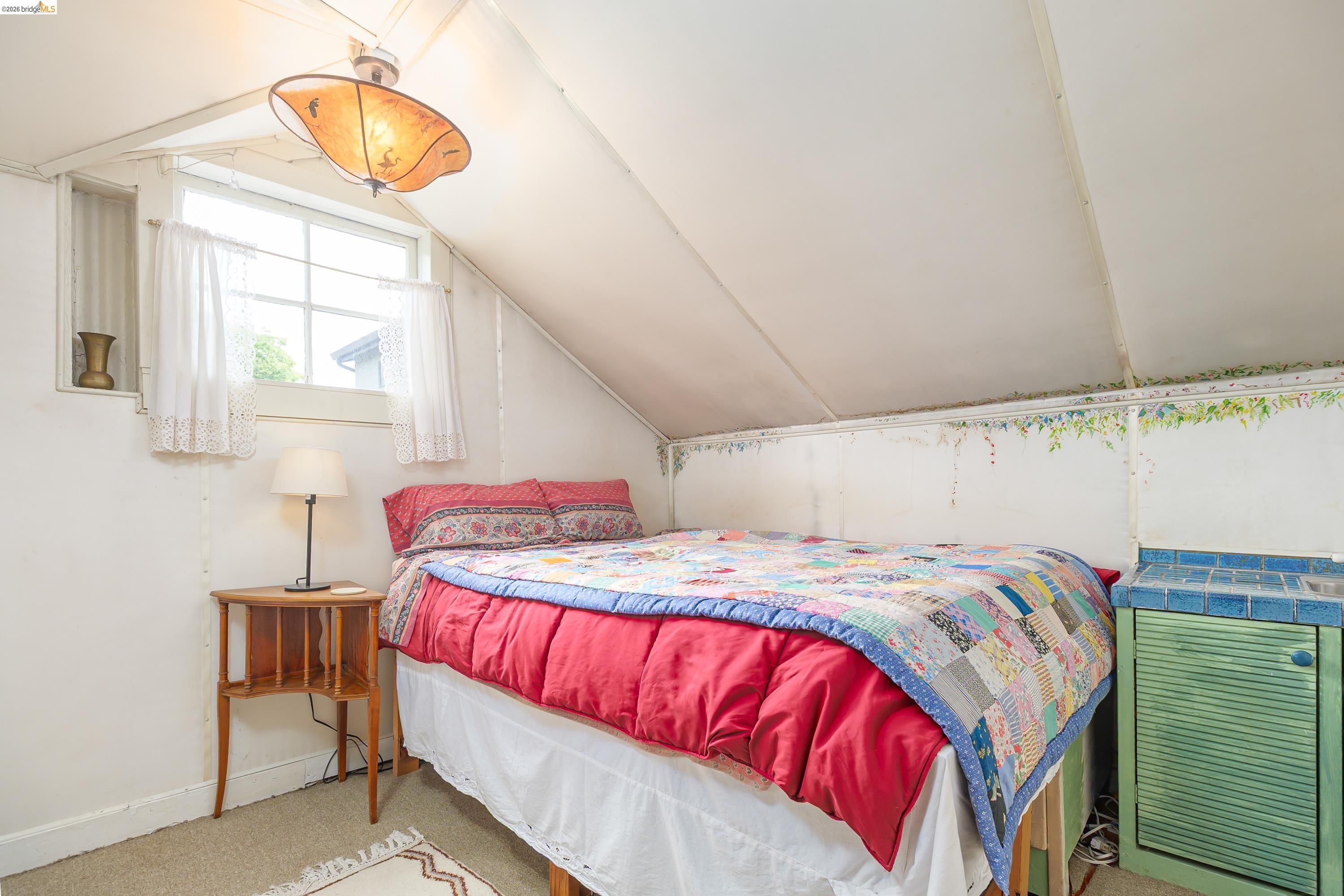1735 Tenth Street Berkeley, CA 94710 - Photo 20 of 50 a bedroom with a bed and window