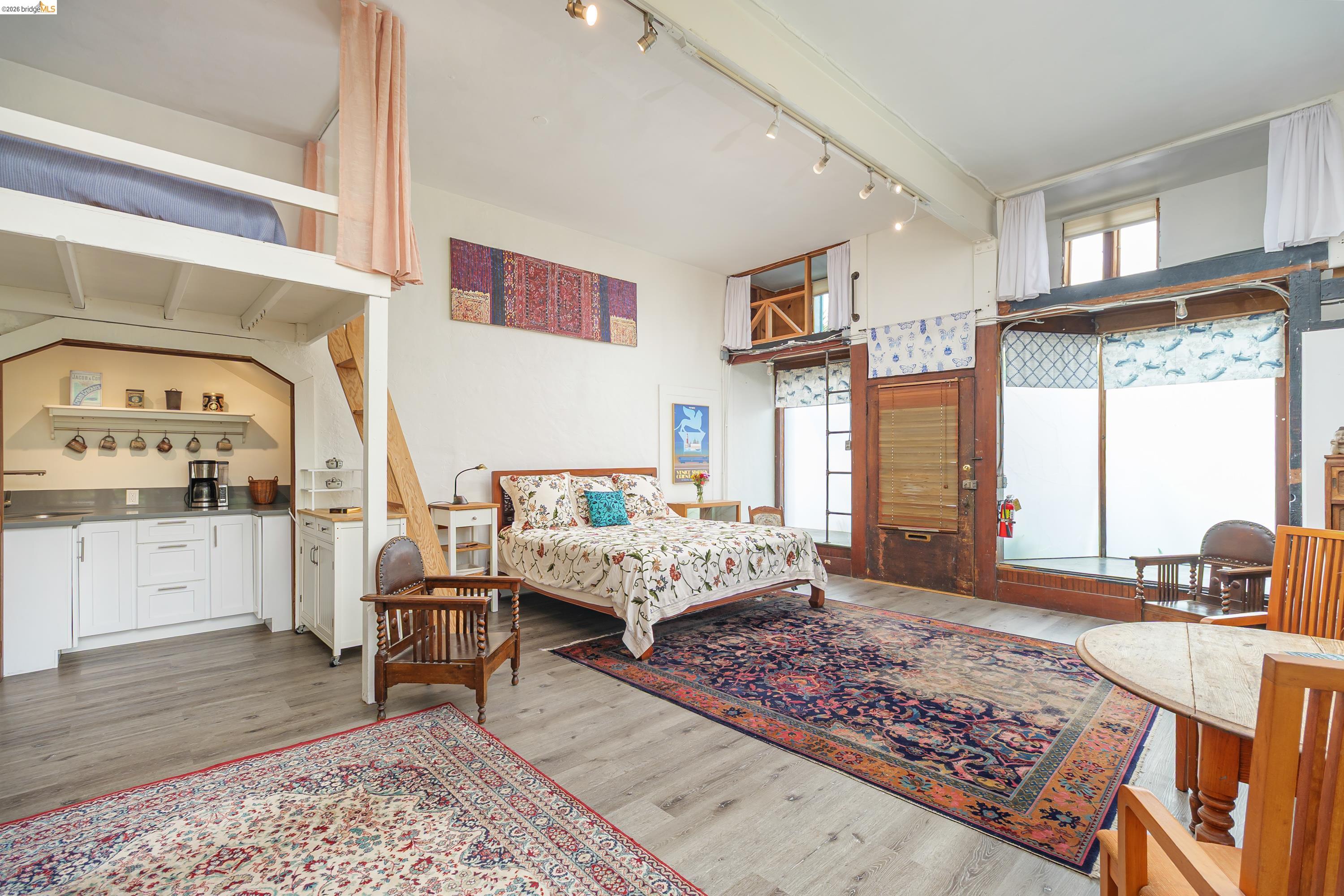 1735 Tenth Street Berkeley, CA 94710 - Photo 21 of 50 a bedroom with furniture and a large window