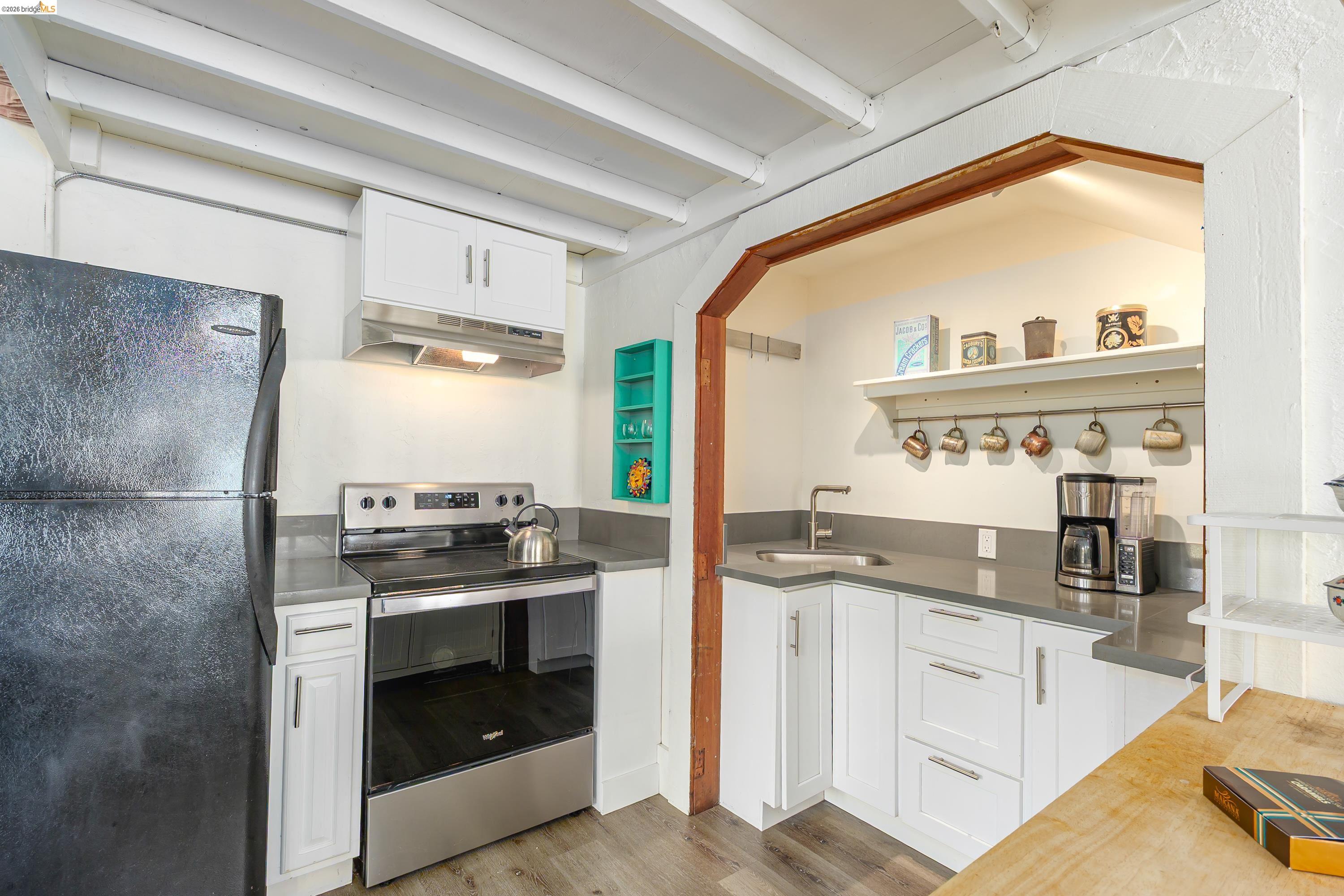 1735 Tenth Street Berkeley, CA 94710 - Photo 24 of 50 a kitchen with stainless steel appliances granite countertop a stove and a sink