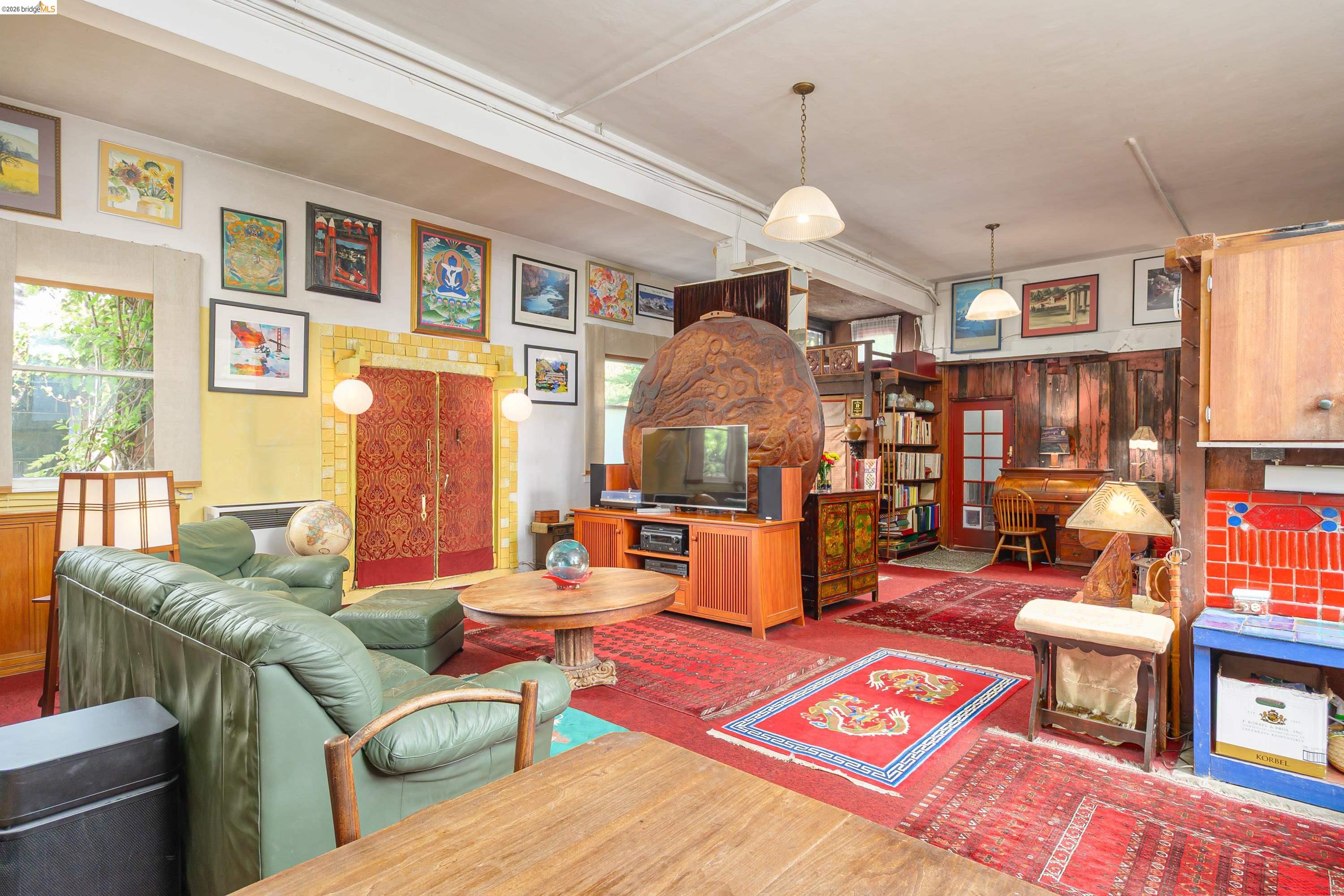 1735 Tenth Street Berkeley, CA 94710 - Photo 28 of 50 a living room filled with furniture and a chandelier