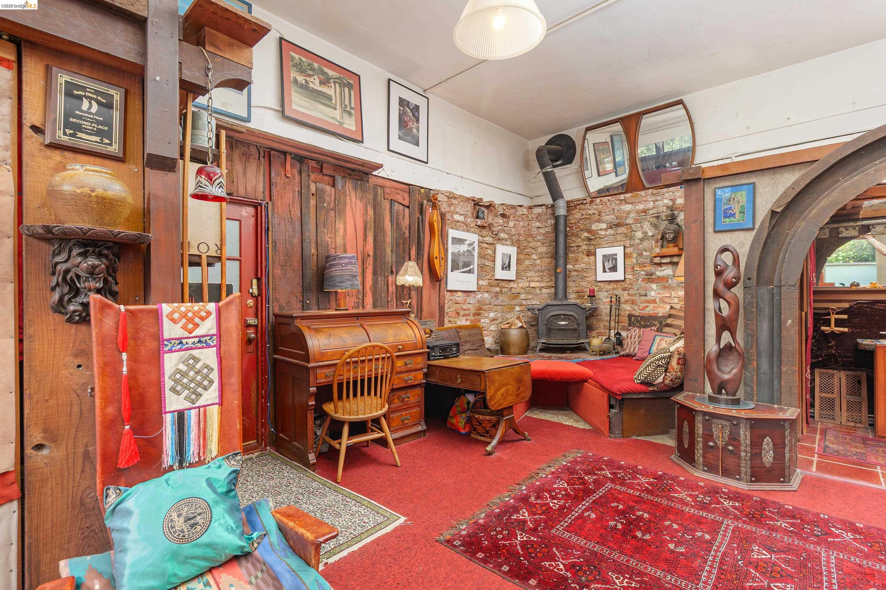 1735 Tenth Street Berkeley, CA 94710 - Photo 30 of 50 a room with furniture a rug and a window