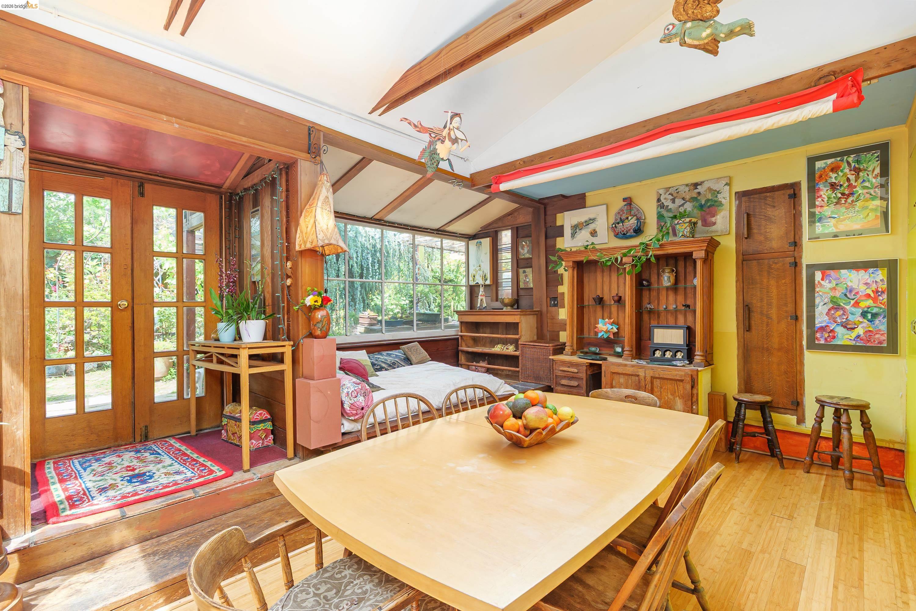 1735 Tenth Street Berkeley, CA 94710 - Photo 36 of 50 a view of a dining room with furniture a chandelier and wooden floor