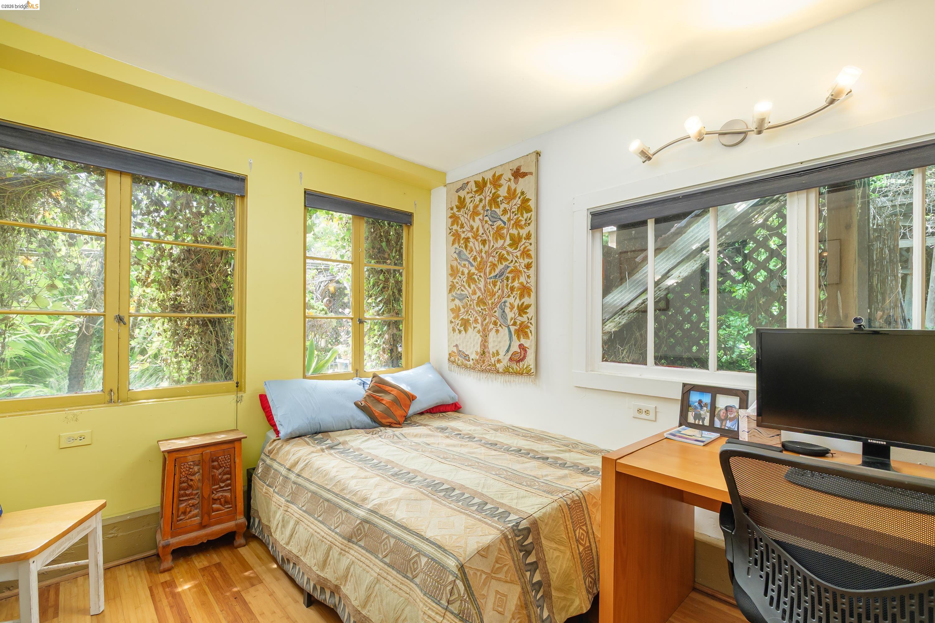 1735 Tenth Street Berkeley, CA 94710 - Photo 42 of 50 a bedroom with a bed and large window