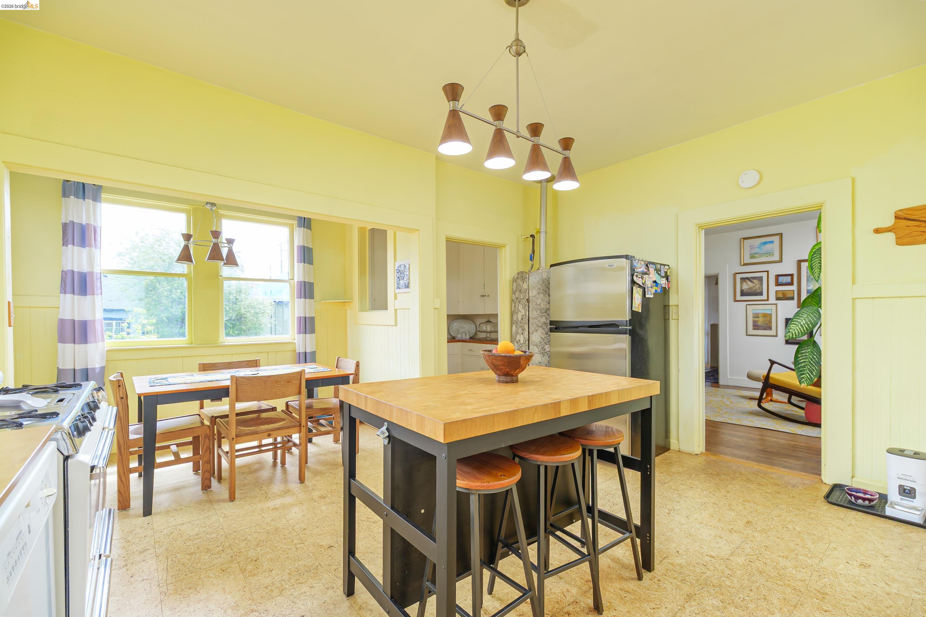 1735 Tenth Street Berkeley, CA 94710 - Photo 7 of 50 a view of a dining room with furniture and a chandelier