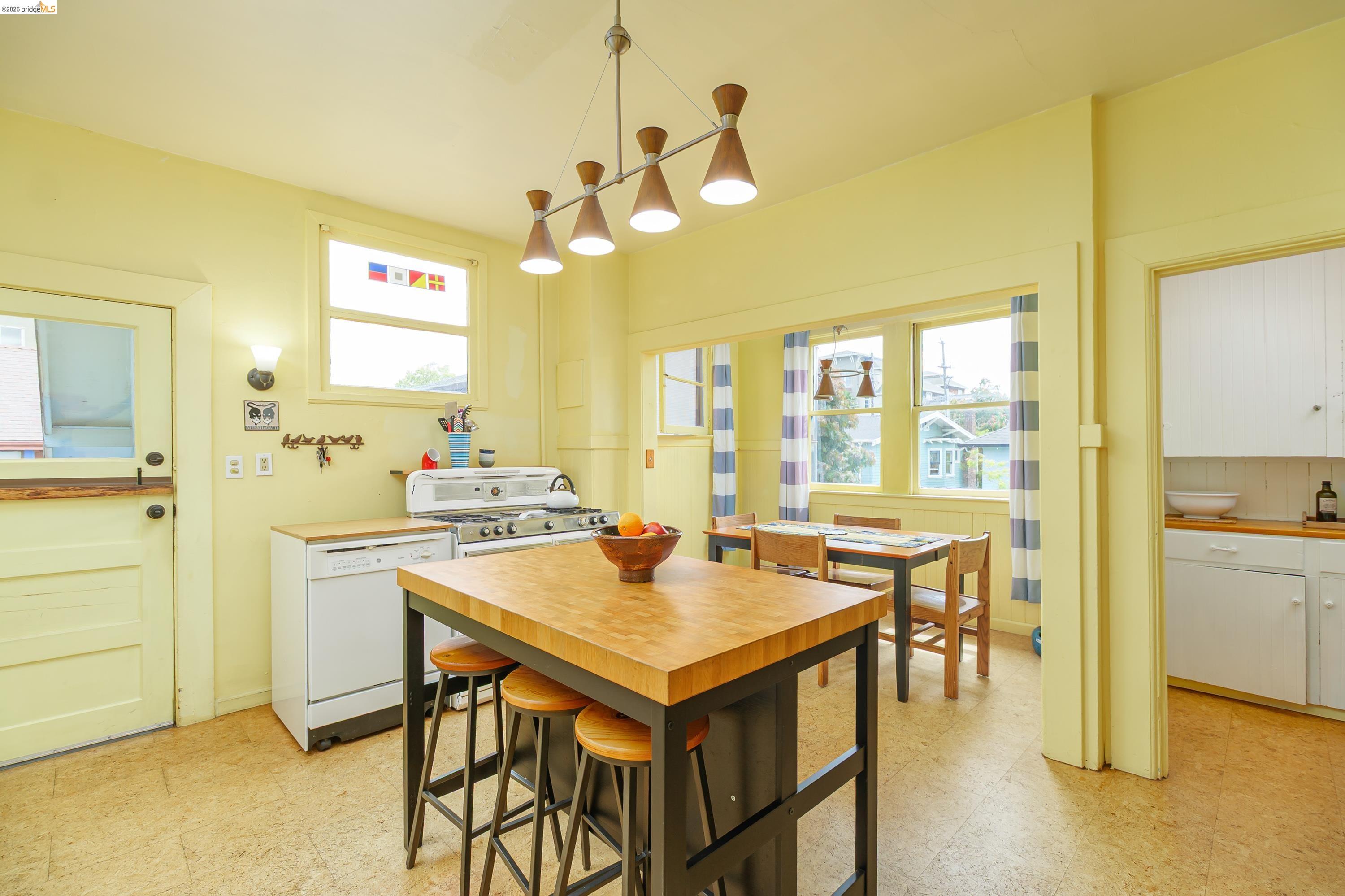 1735 Tenth Street Berkeley, CA 94710 - Photo 8 of 50 a view of a dining room with furniture and a chandelier