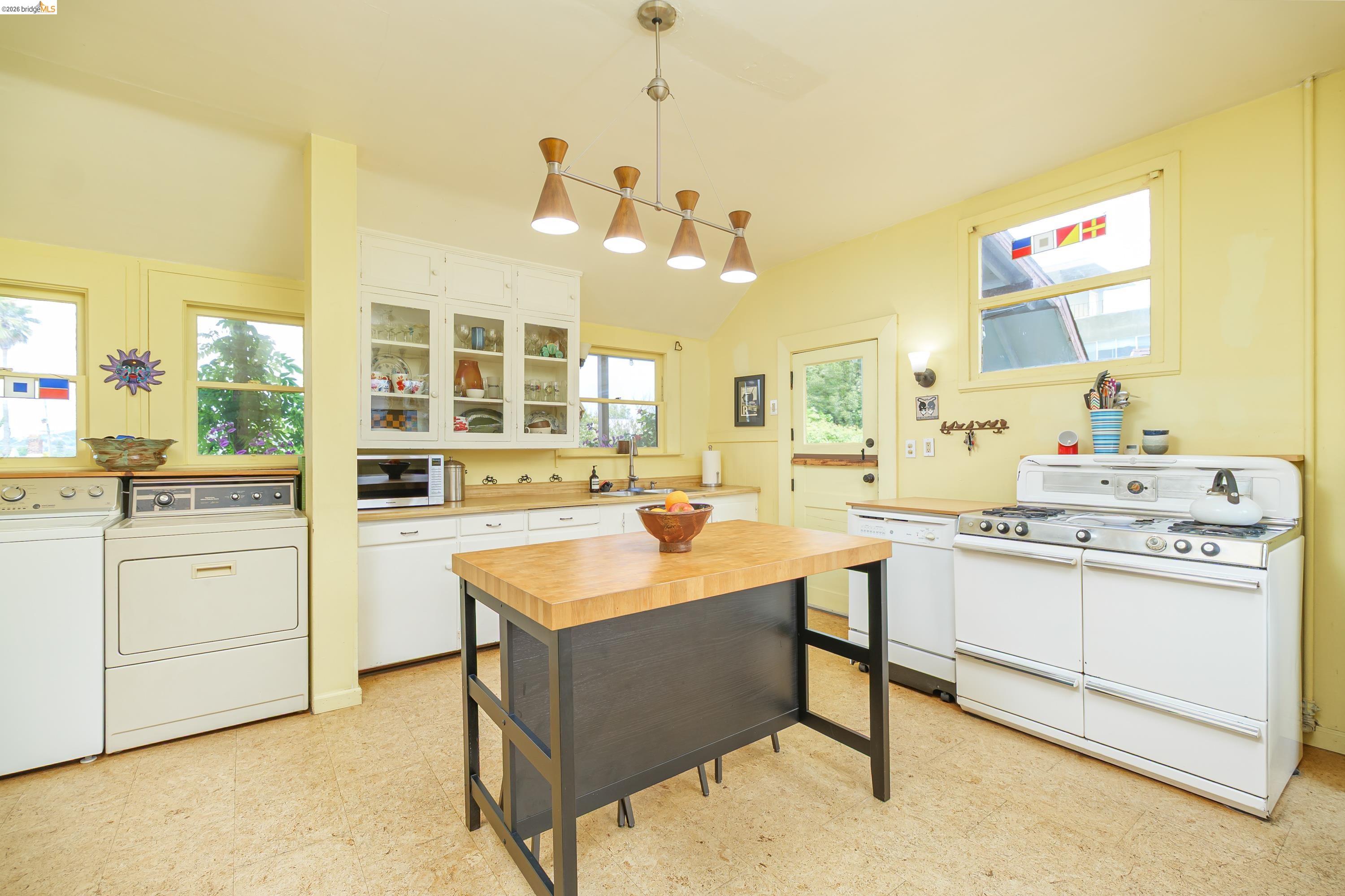 1735 Tenth Street Berkeley, CA 94710 - Photo 9 of 50 a kitchen with a sink and cabinets