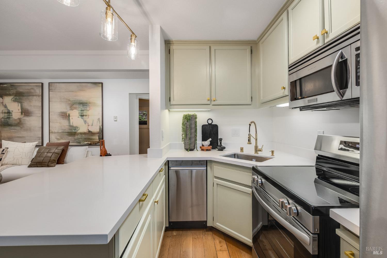 108 Stanford Way Sausalito, CA 94965 - Photo 17 of 43 a kitchen with a sink and stainless steel appliances
