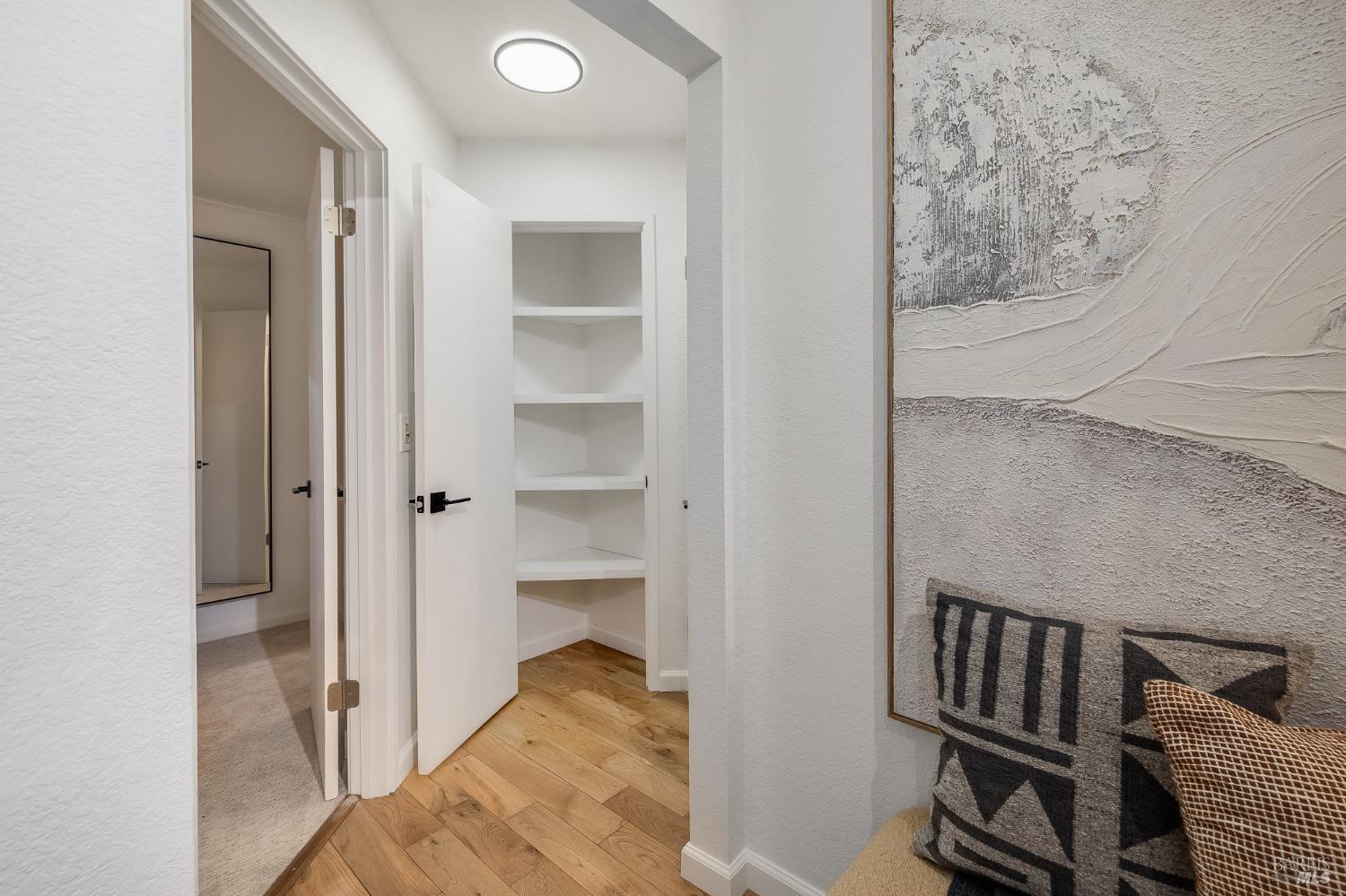 108 Stanford Way Sausalito, CA 94965 - Photo 20 of 43 a view of a livingroom with wooden floor and closet
