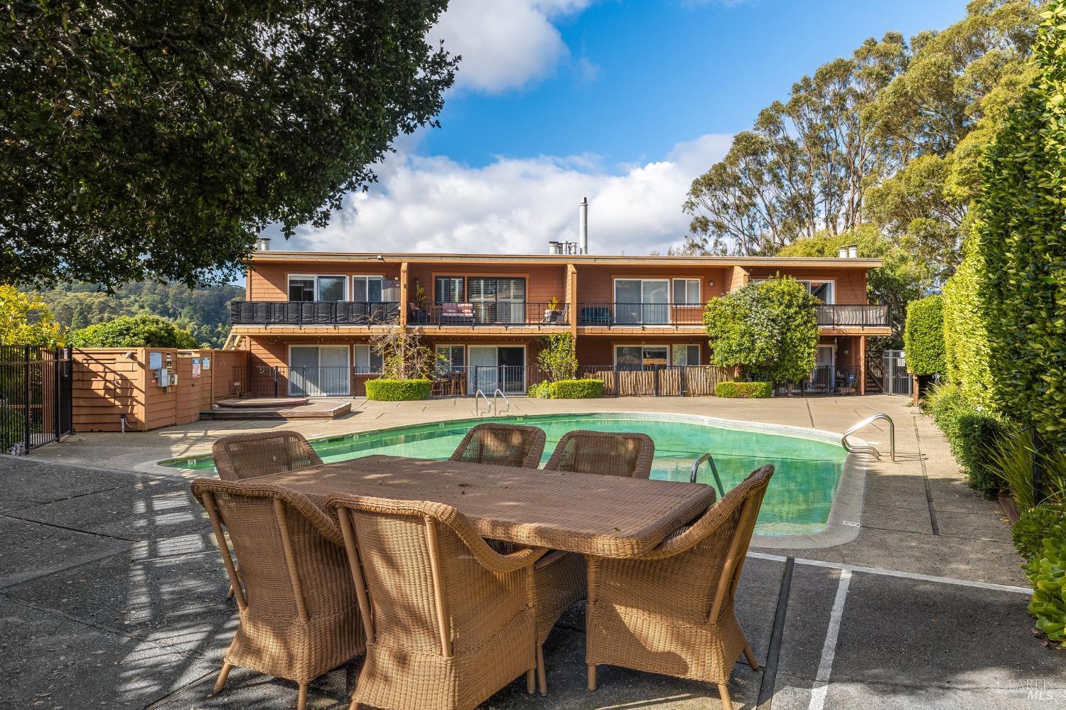 108 Stanford Way Sausalito, CA 94965 - Photo 34 of 43 a view of a patio with table and chairs with wooden floor and fence