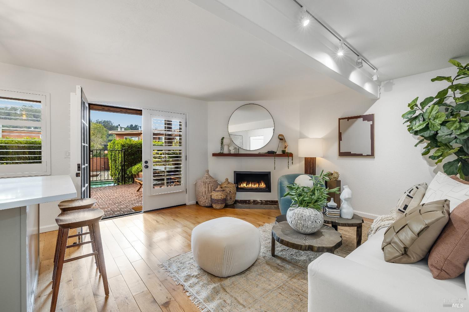 108 Stanford Way Sausalito, CA 94965 - Photo 9 of 43 a living room with furniture and a fireplace