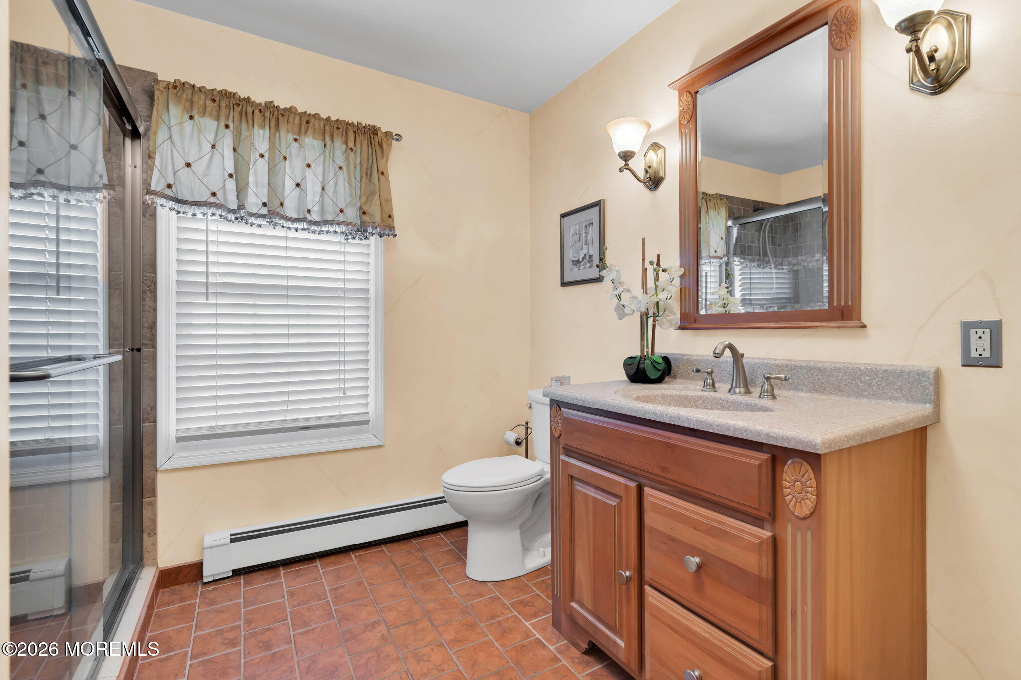 83 Seawood Drive Keyport, NJ 07735 - Photo 17 of 23 a bathroom with a toilet sink and mirror