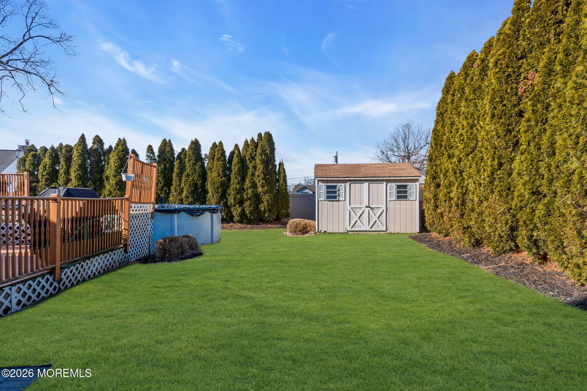 83 Seawood Drive Keyport, NJ 07735 - Photo 19 of 23 a view of an house with backyard space and garden