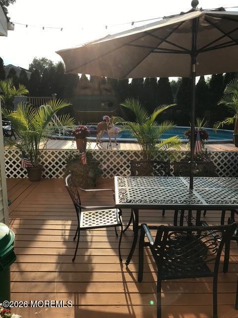 83 Seawood Drive Keyport, NJ 07735 - Photo 20 of 23 a terrace with outdoor seating and trees