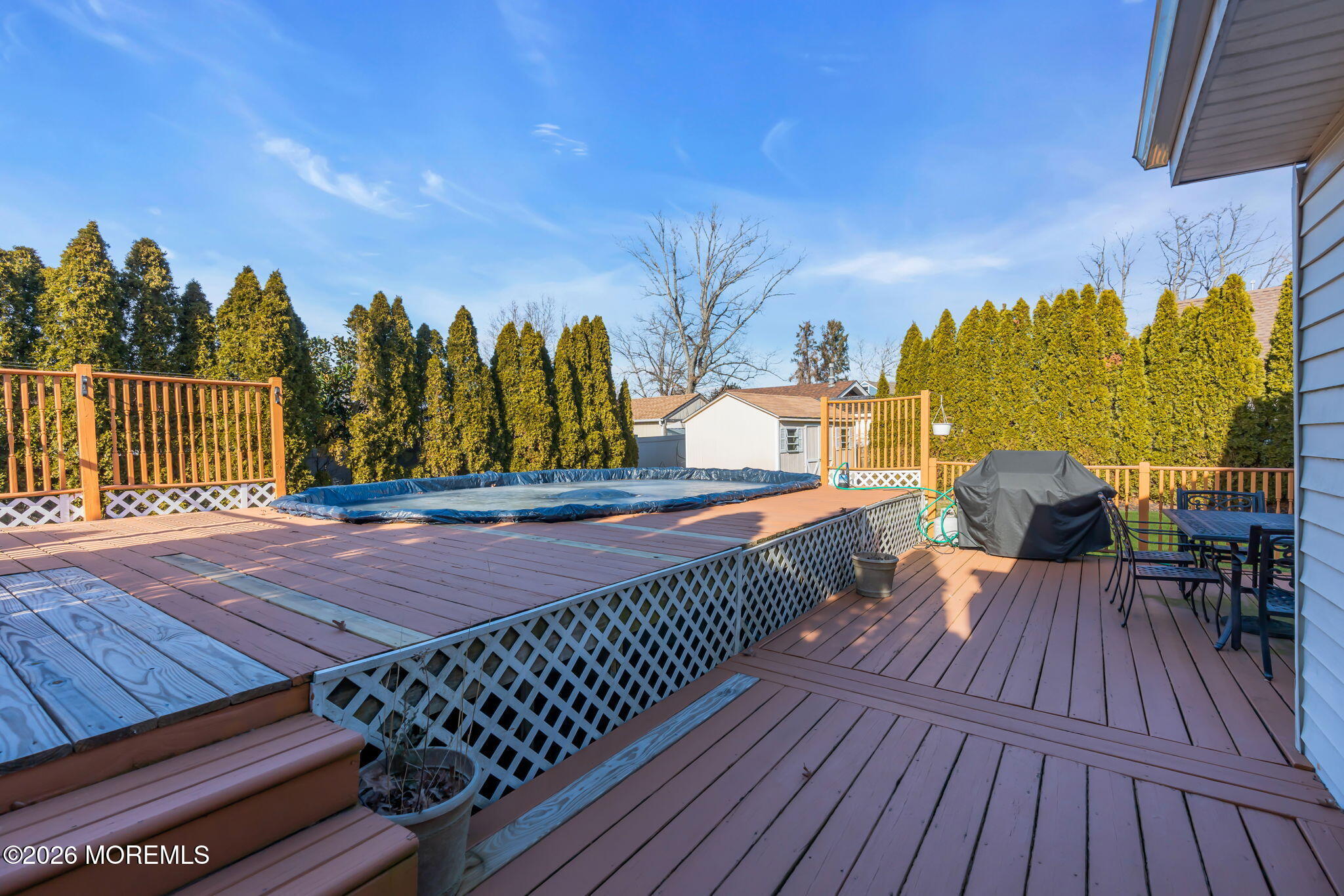 83 Seawood Drive Keyport, NJ 07735 - Photo 21 of 23 a balcony with wooden floor and outdoor seating