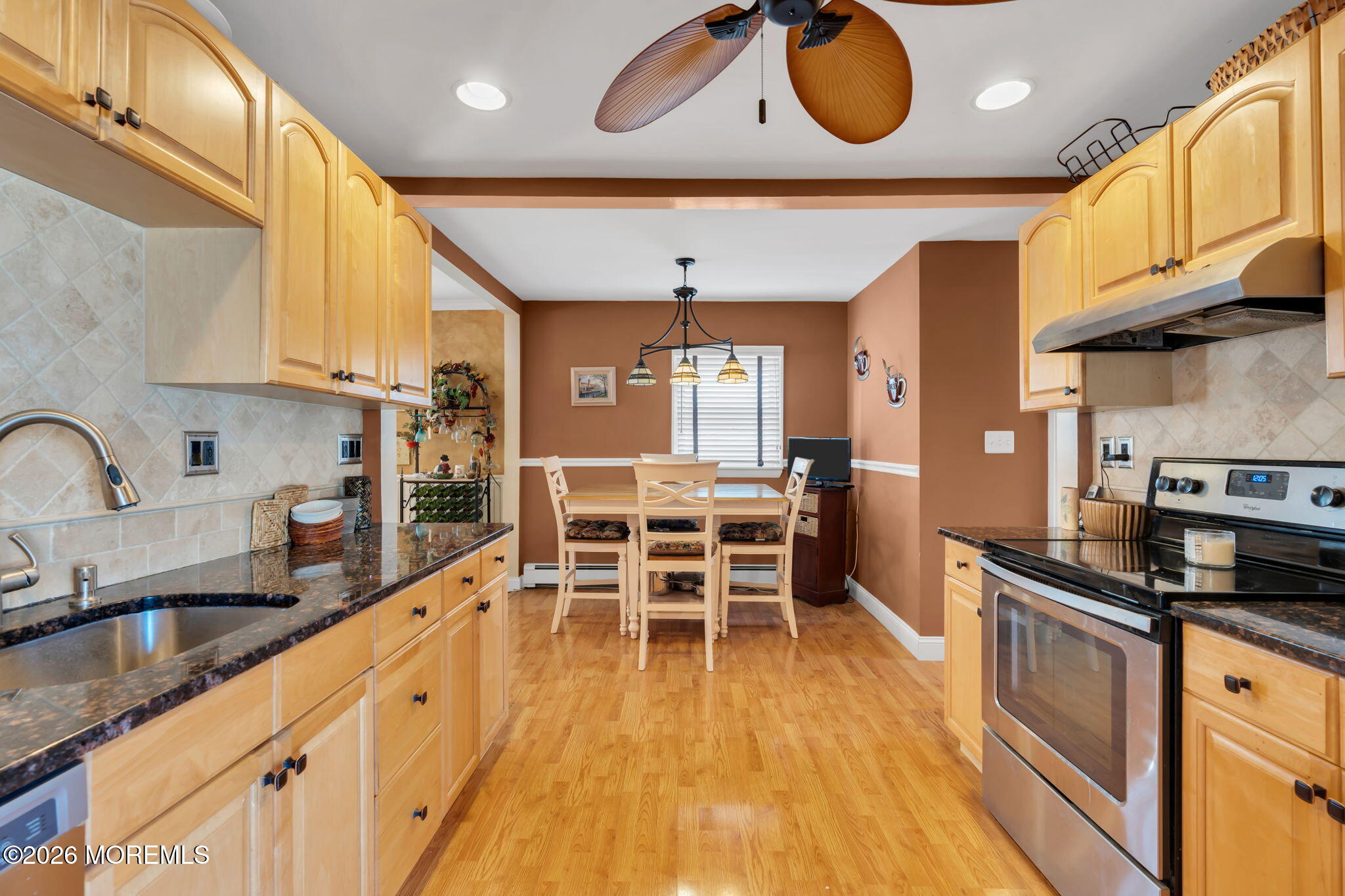83 Seawood Drive Keyport, NJ 07735 - Photo 7 of 23 a kitchen with granite countertop a stove a sink and a refrigerator